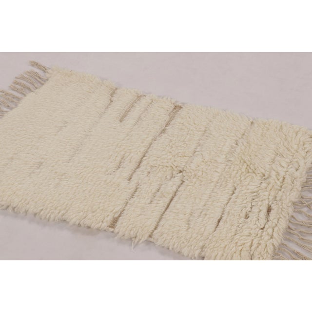 This 2x3 Moroccan-style rug is a tactile, high-pile composition handwoven in wool in India. Inspired by the enduring...