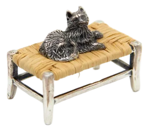 Miniature Silver Cat Lying on Table