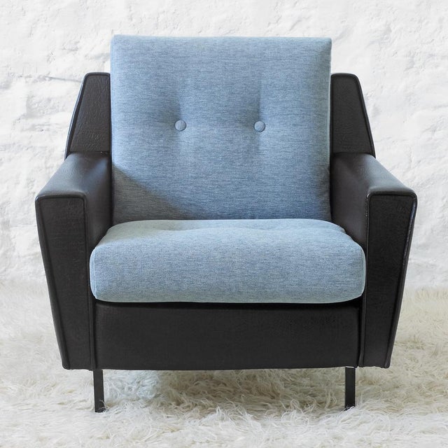 Wooden structure upholstered in black scaffold, seat and backrest reupholstered in sea blue chenille; black metal legs....