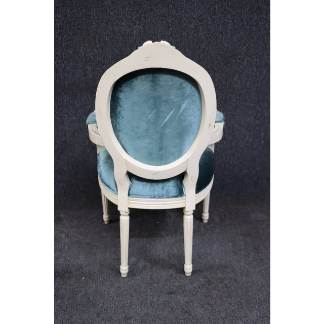 Louis XV Style off-white carved round back arm chair in teal velvet.