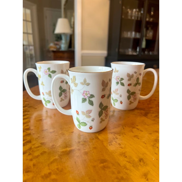 Vintage Wedgwood Wild Strawberry Mug With Gold Trim. These beautiful bone china mugs feature gold trim on the rim and a...