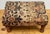 Antique footstool with brocade-style floral fabric to upper deck and turned wood legs. Rectangular in shape and sturdy.