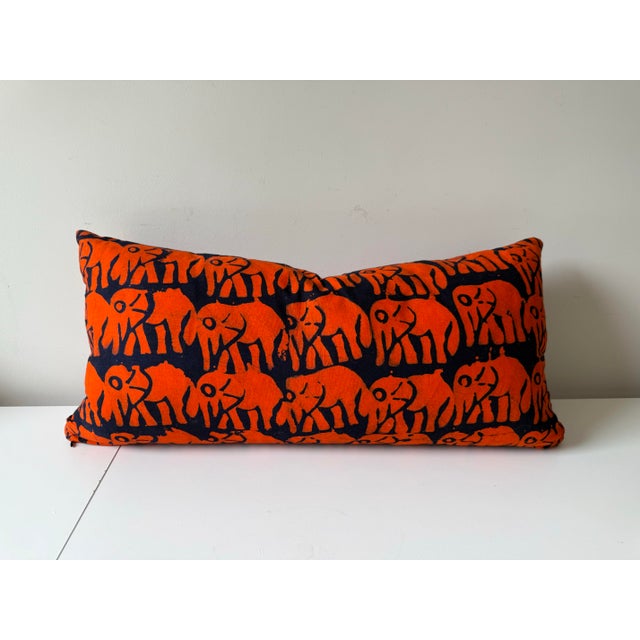 Hand Dyed Elephant Block Print Lumbar Pillow in a dark navy and vibrant orange. Cotton cover with zipper and down filled...