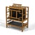 This handsome magazine rack with a frame of rattan supporting pannels of ebonized cane has two vertical compartments on...