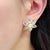A striking pair of opal and prasiolite earrings crafted in 14ct yellow gold. Each centre opal shows vivid iridescence,...