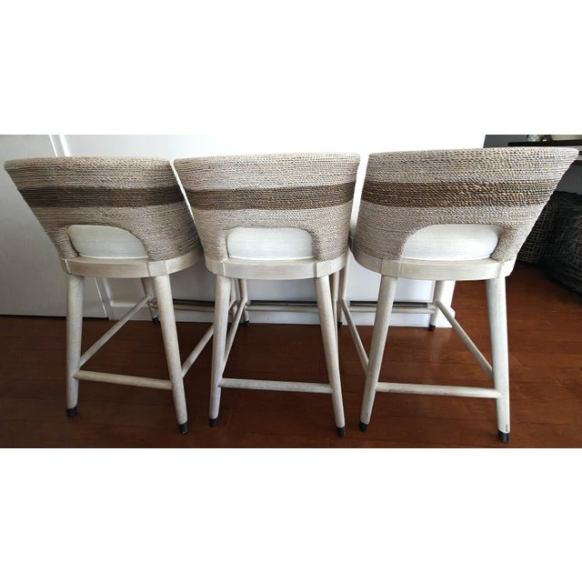 Palecek Fritz Rope Counter Stool Kirk Nix Collection. Hardwood frame and legs with pewter finish foot caps and footrest on...