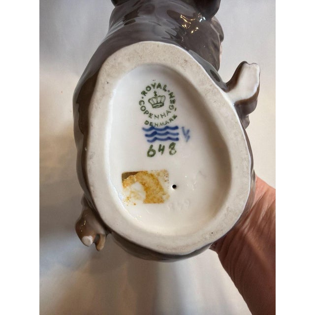 Vintage Royal Copenhagen Faun with Bear porcelain figurine, model #648. This classic Danish collectible features a...