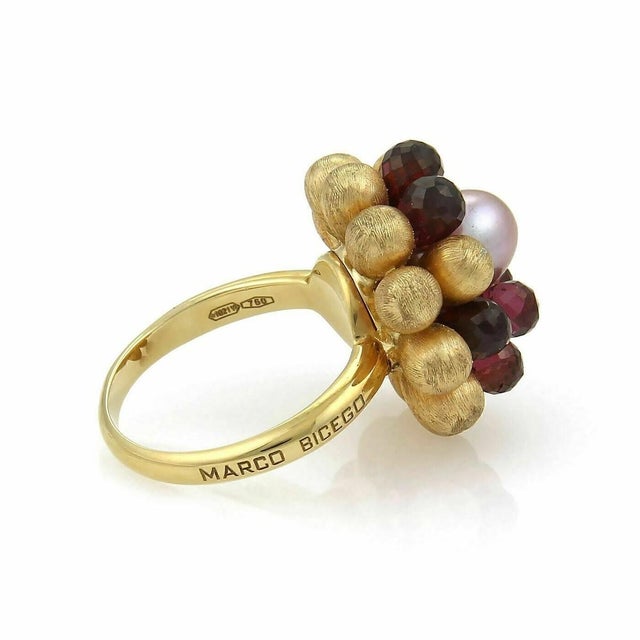 The Marco Bicego Paradise Tourmaline & Pearl Cluster 18k Yellow Gold Ring in size 7 is a luxurious and elegant piece of...