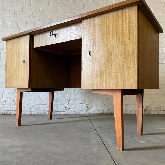 Dimensions: H 29.7” x W 47.3” x D 21.3” Vintage Dutch desk with one small central drawer and two big on both size. A...