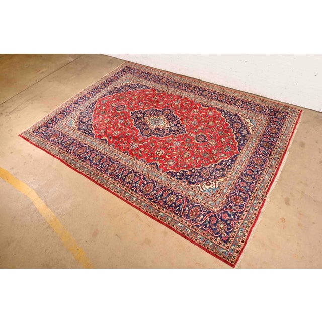 A gorgeous vintage hand-knotted Persian Kashan room size wool rug Circa Mid-20th Century Beautiful floral design, with...