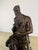 Hand cast bronze sculpture depicting a seated, bearded Moses, rendered in the tradition of classical and Renaissance...