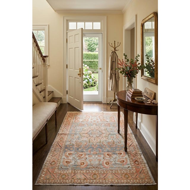 An antique 1920s Persian Sarouk Rug with salmon and terracotta accent blue gray field rug