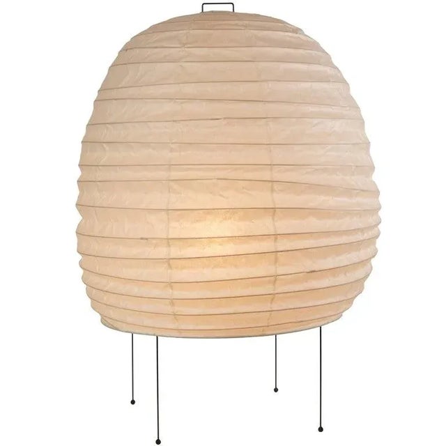Akari Model 20N light sculpture by Isamu Noguchi. The shade is made from handmade washi paper and bamboo ribs with Noguchi...