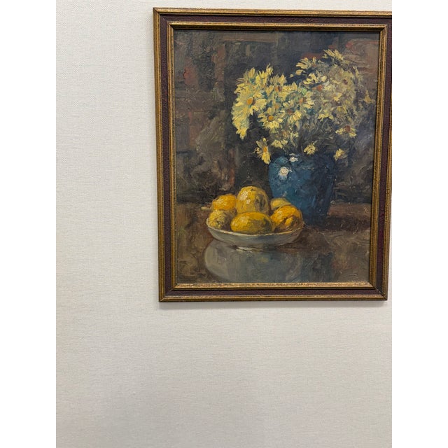 A wonderful oil on canvas hand painted 'vase of flowers with lemons'. This painting features bowl of lemons and an...