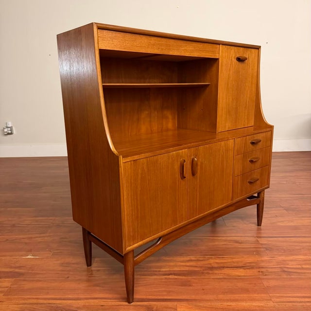 Vintage compact teak tall sideboard bar from the G-Plan Brasilia range, made in the U.K. circa 1960's. Featuring clean...