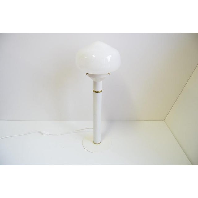 The lamp is made of lacquered metal, brass, and a glass shade The metal part shows signs of use (see photo) The brass has...