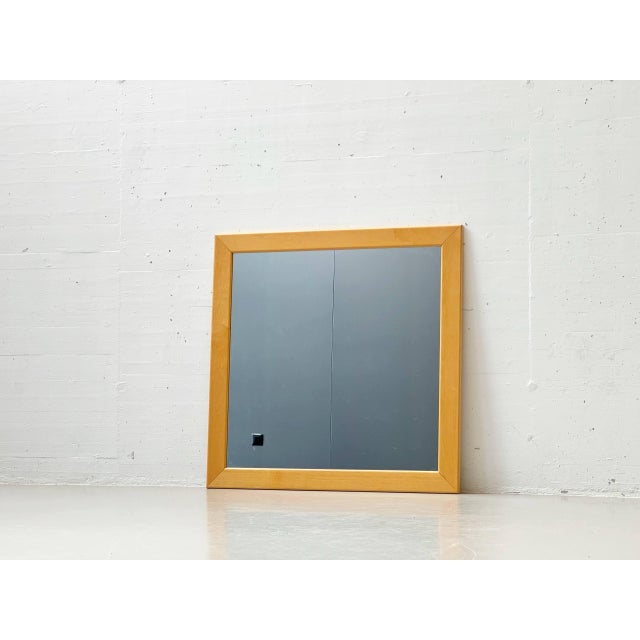 A timeless wall mirror in the clean, minimalist style of the 1960s. The wide frame, crafted from light-grained maple,...