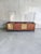 A large four-door teak sideboard from the Itaca series, manufactured by Saima of Pavia, Italy. The cabinet features...