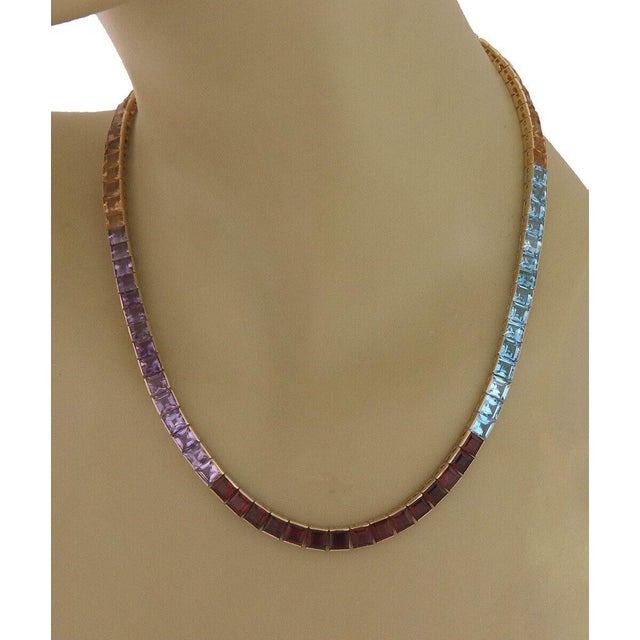 This is a lovely collar necklace, it is crafted from 14k yellow gold featuring square shape semi-precious colored...