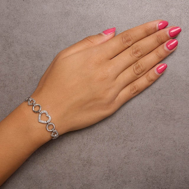 .925 Sterling Silver Diamond Accent Interlinking Triple Heart 4���-10��� Adjustable Bolo Tennis Bracelet (H-I Color, I2-I3 Clarity) For Sale - Image 4 of 5