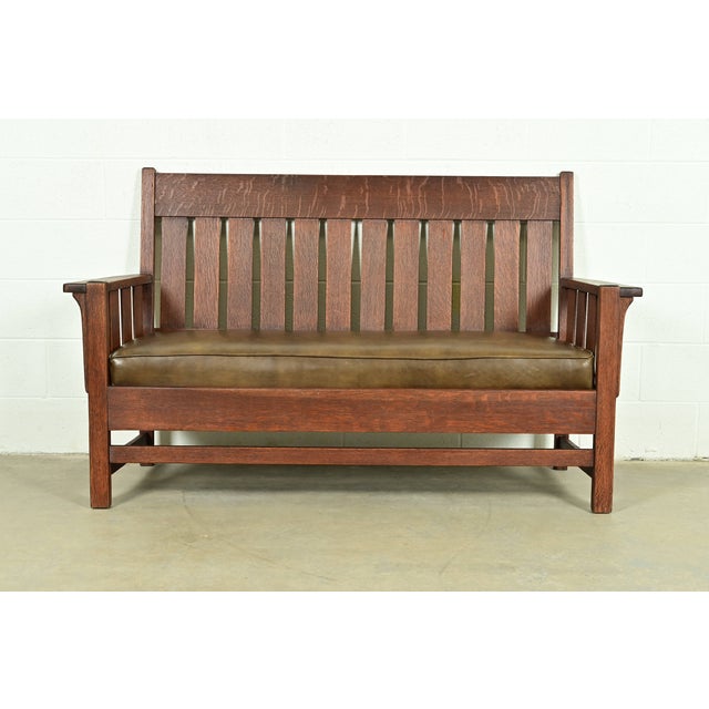An exceptional antique Mission or Arts & Crafts period bench, settle sofa, settee, or love seat In the manner of Gustav...