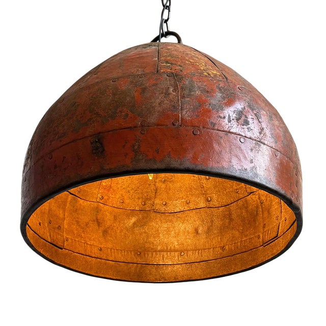 Vintage iron pendant light crafted from a hand-forged bowl from early–mid 20th century India. Such vessels were...