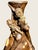 8” high 5.5” wide, a very unusual thick walled terra cotta vase with two highly raised mermaids each having thin strands...