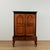 19th century Ceylonese colonial cupboard constructed of richly figured teak with contrasting ebonized moldings and turned...