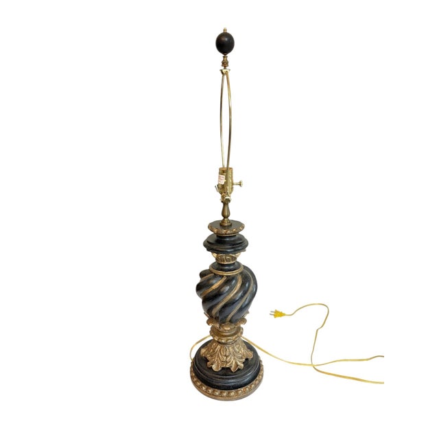 Chelsea House Spiral Black and Gold Lamp This lamp has a round base with rope details. There is an urn shaped center that...