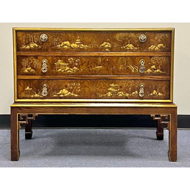 Stunning Burl three drawer commode / chest by Hekman with gold and bronze hand painted chinoiserie decoration depicting...