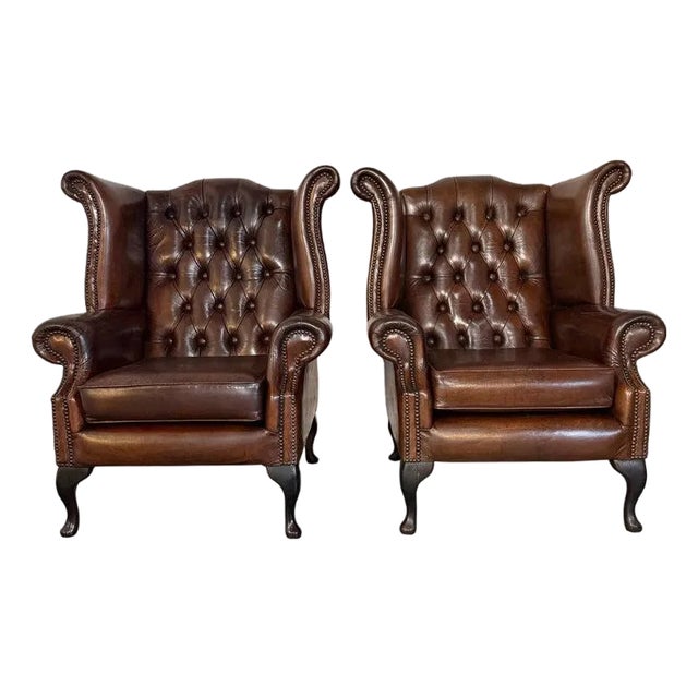 Pair of Vintage English Tufted Leather Wingback Armchairs For Sale