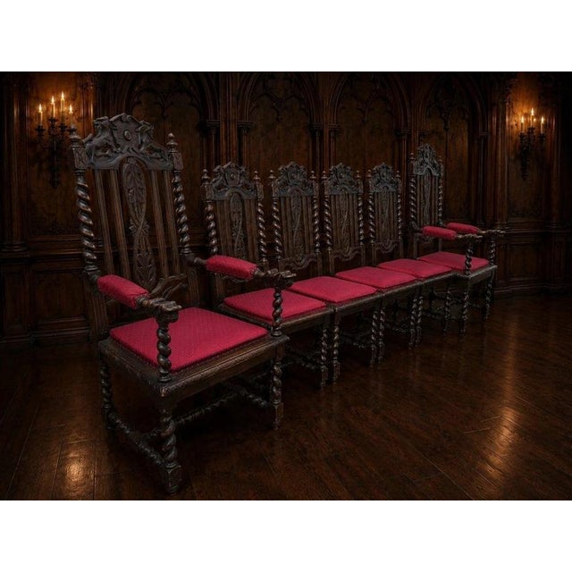 An exceptional matched set of six late 19th-century carved oak dining chairs, comprising four high-back side chairs and...