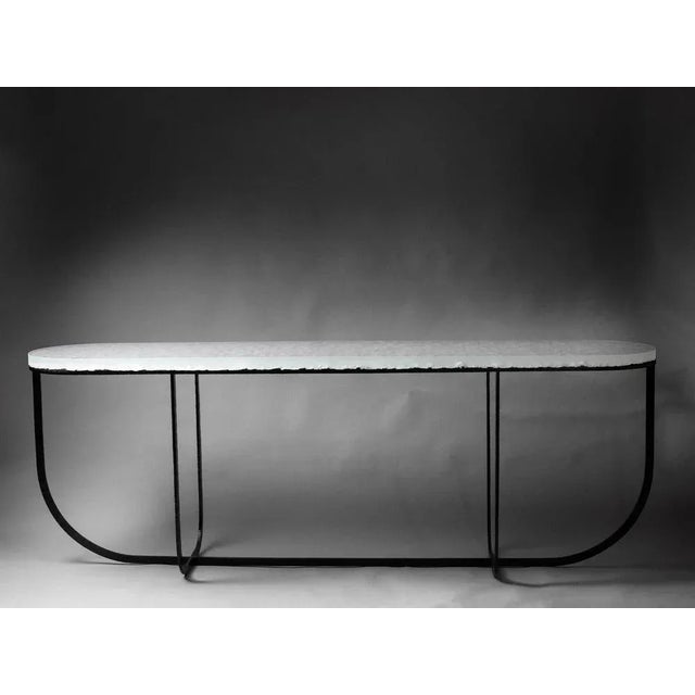 Yugen console by matthieu gicquel dimensions: d 50 x w 230 x h 80 cm. Materials: optical glass and patinated metal....