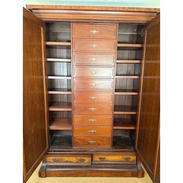 Stunning, expertly remodeled, antique Victorian walnut wardrobe dating to the late 19th century. This substantial two-door...