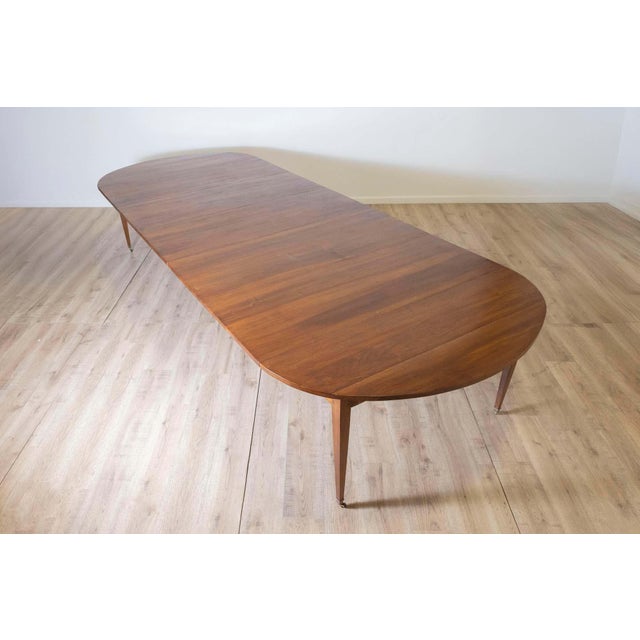 This exquisite 20th Century French extension dining table combines functionality with the timeless elegance of traditional...