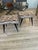 A pair of ebony benches with brass legs from the 1950s. The benches have new padding and have been reupholstered with...