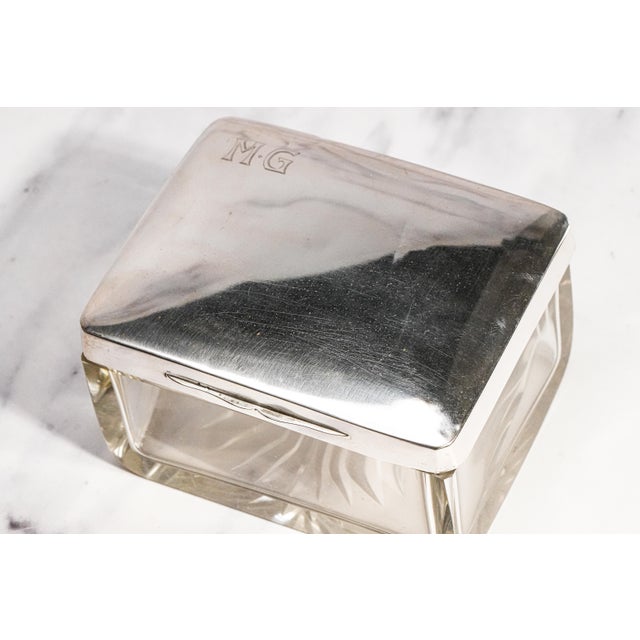 A beautiful expression of Art Deco elegance and German silversmithing, this antique crystal and 800 silver dressing table...