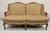 Vintage French Country Louis XV Style Carved Walnut Wingback Sofa Settee. Item features cheetah print microfiber fabric,...