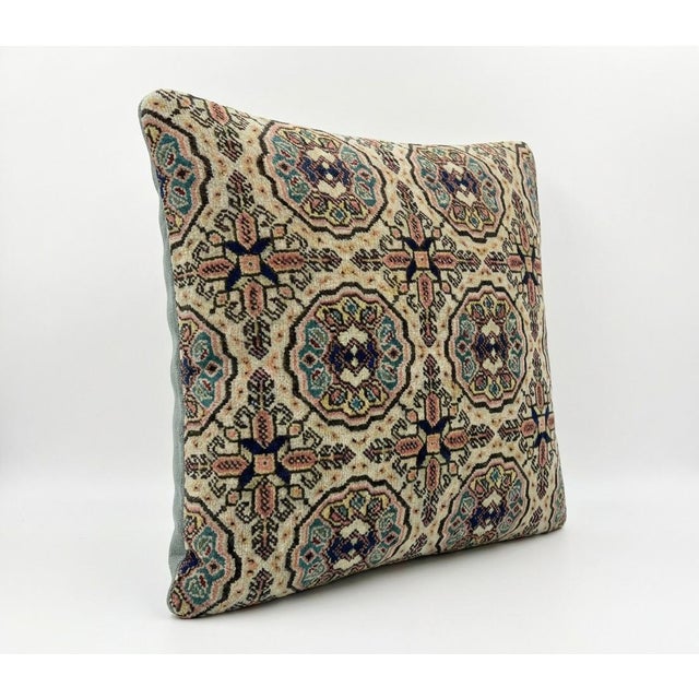 This beautiful 19'' x 19'' pillow cover was made from an authentic Turkish rug. Bright colors of wool adorn the front of...