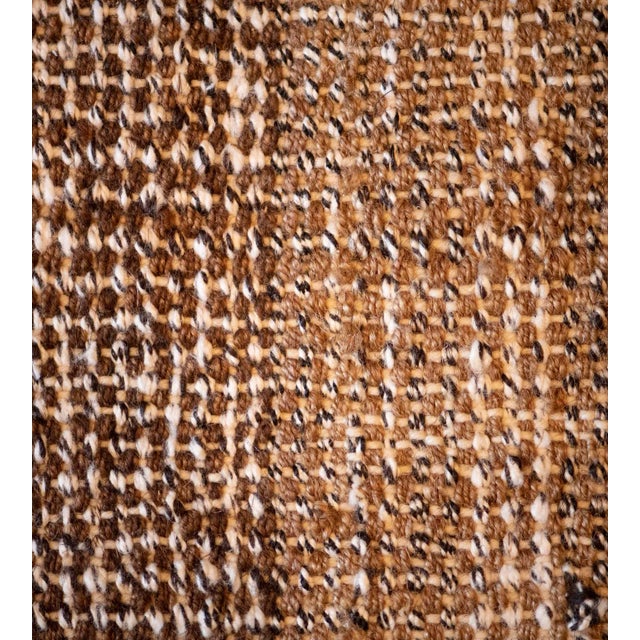 This Turkish Style flatweave rug has a tobacco-brown field woven in horizontal shaded bands of tobacco-brown shades, the...