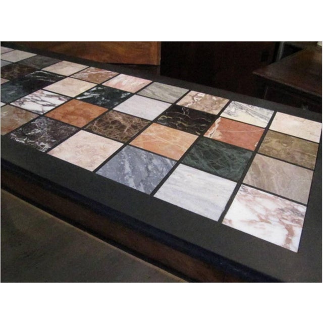 Beautiful console table with a specimen marble top and carved mahogany legs. The top is later in date than base.