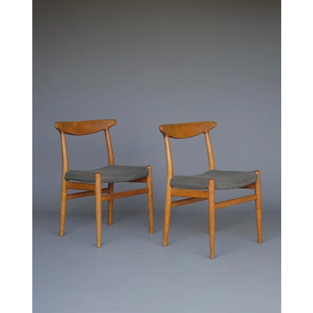 A pair of two beautiful and original 'w2' dining chairs designed by hans j. Wegner and executed by c.m. Madsen in the...