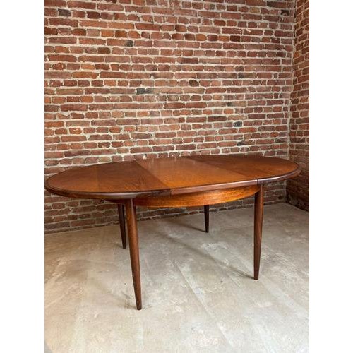 Teak dining table – g-plan, united kingdom (1961) bring the iconic elegance of british design to your table with this...