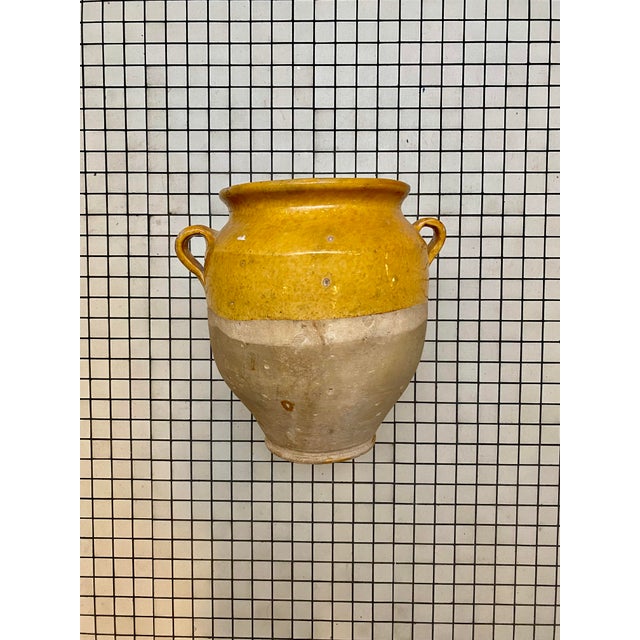 Beautiful 19th century French terracotta coffee pot with its characteristic warm mustard glaze and classic double handle....