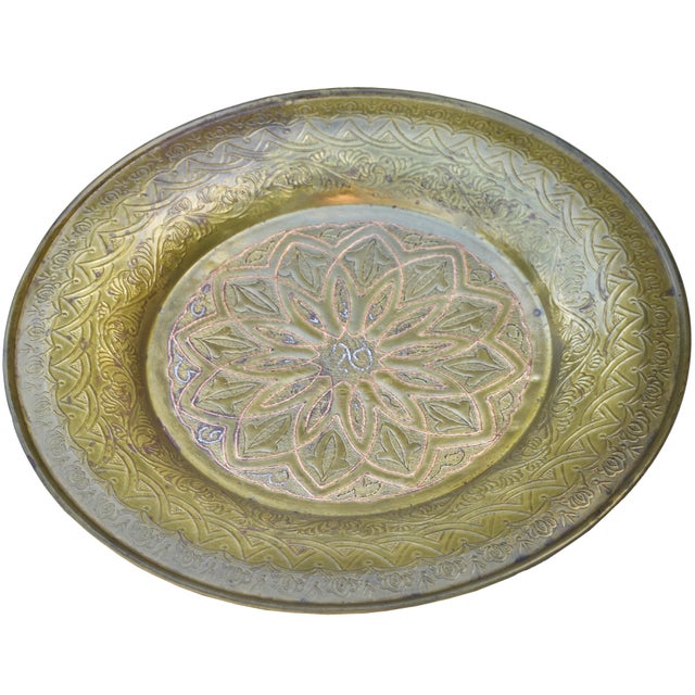 One-of-a-kind antique handcrafted and detailed Moroccan solid brass tray. Featuring elaborate hand-engravings and...