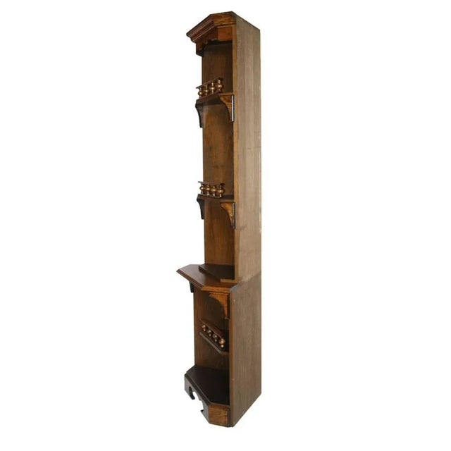 This early 20th-century corner shelf is made of solid oak. The lower part is 81 cm high.