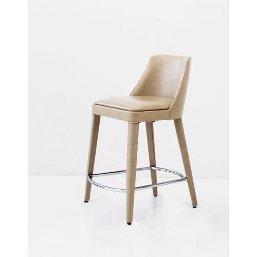 Lola Pale Anilina Ecoleather And Beech Wood Chair Low Stool by Casa Casati Dimensions: D 60 x W 60 x H 96 cm. Materials:...