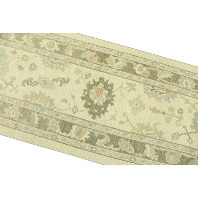 Transform your living space with this exquisite Hand-Knotted Modern Turkish Oushak Rug. Measuring 2'9" x 7'9", this...