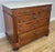 This elegant Vintage French marble top chest of drawers offers timeless styling with refined shaping, decorative...