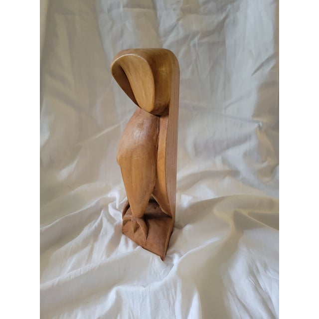Nice modernist owl figure. Hand carved out of wood, maybe pine or maple. Has a satin finish to it. Stands 12" tall and 7"...
